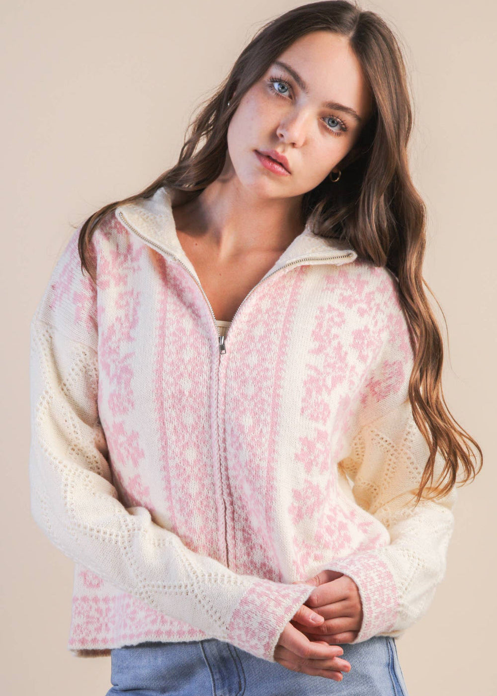 Woman wearing a floral patterned jacket against a plain background