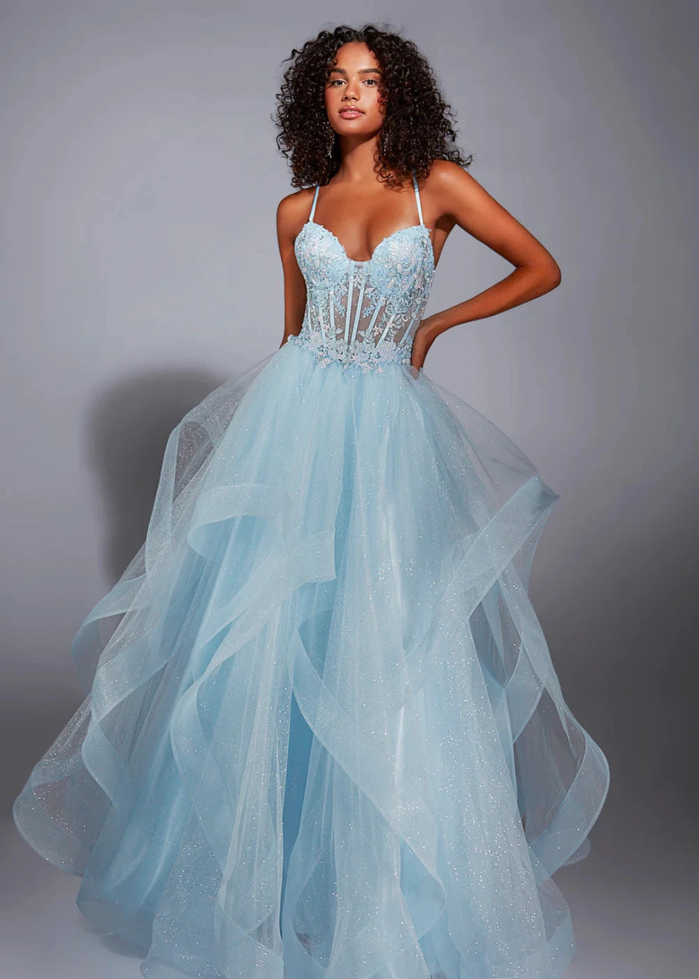 This image features the "Alyce 1856" dress, showcased in an elegant light blue color. The dress impresses with its sophisticated deep V-neckline and striking beaded embellishments that enhance the bodice.