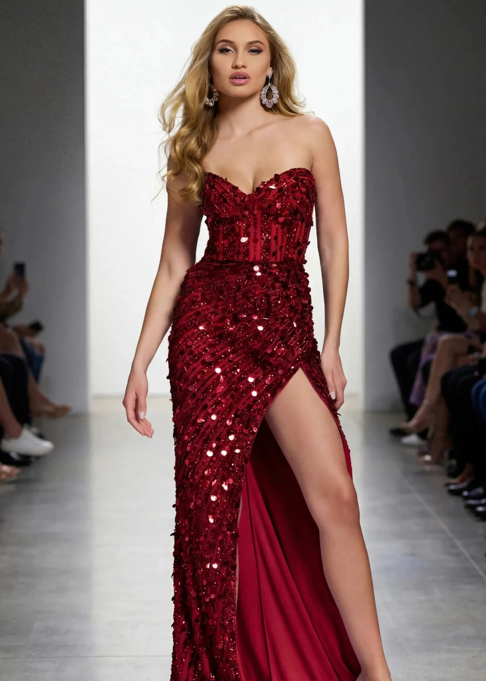 Model wearing a red sequin evening gown on a runway