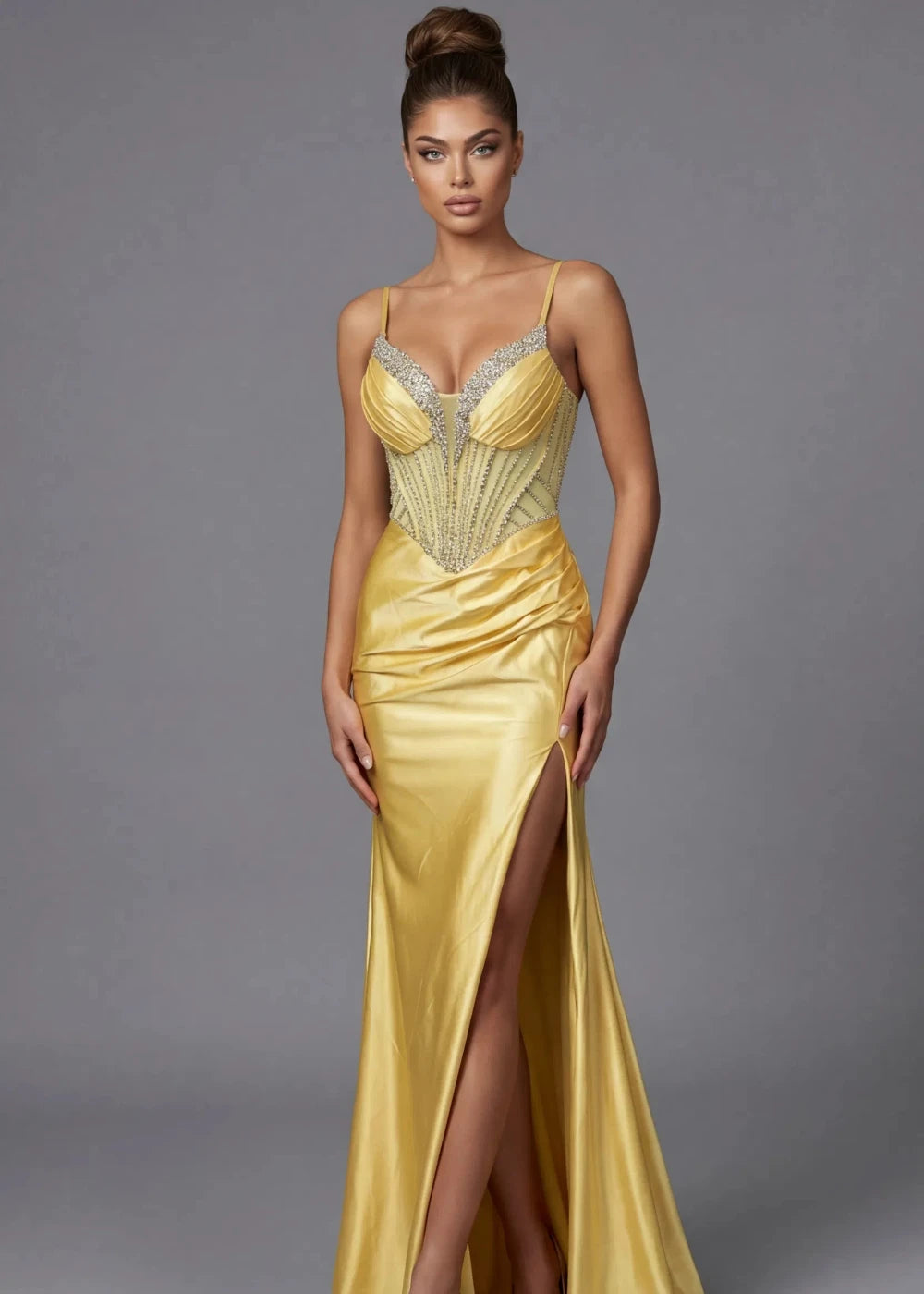 Woman wearing a gold evening gown with a gray background